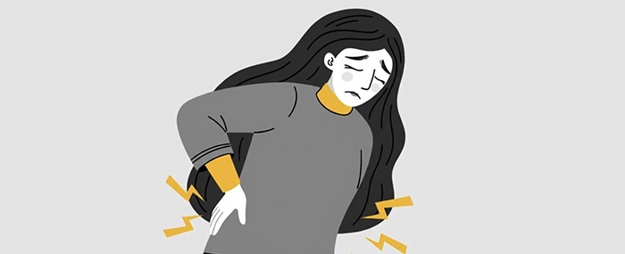 woman suffers from chronic back pain