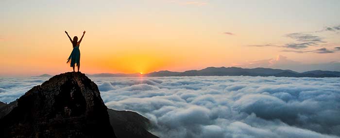 courageous woman on a mountain