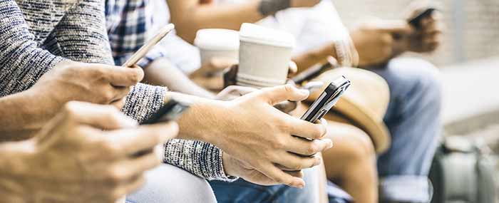 teen students on phones